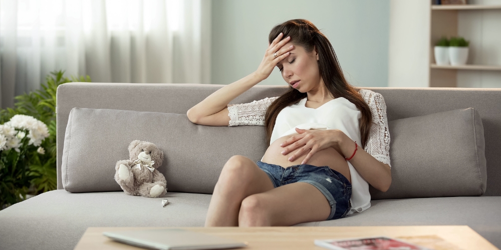 Woman experiencing fatigue and mood swings due to hormone imbalance